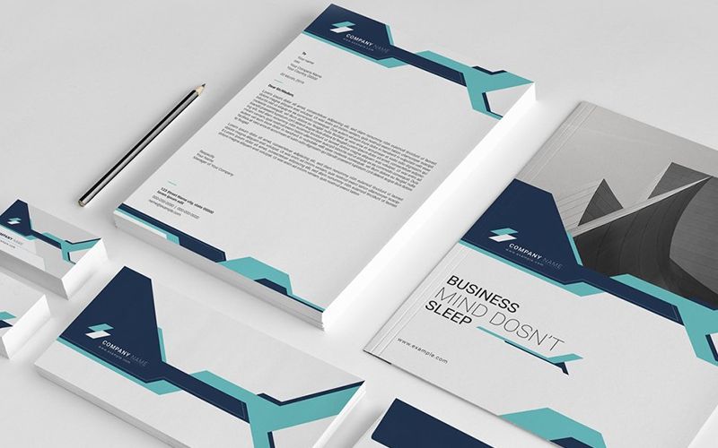 Professionelt brevpapir og visitkort med moderne geometrisk design.